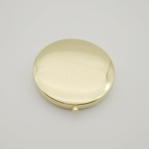 Mia Beauty Jeweled Compact mirror with gold metal and glass rhinestone back side shown closed